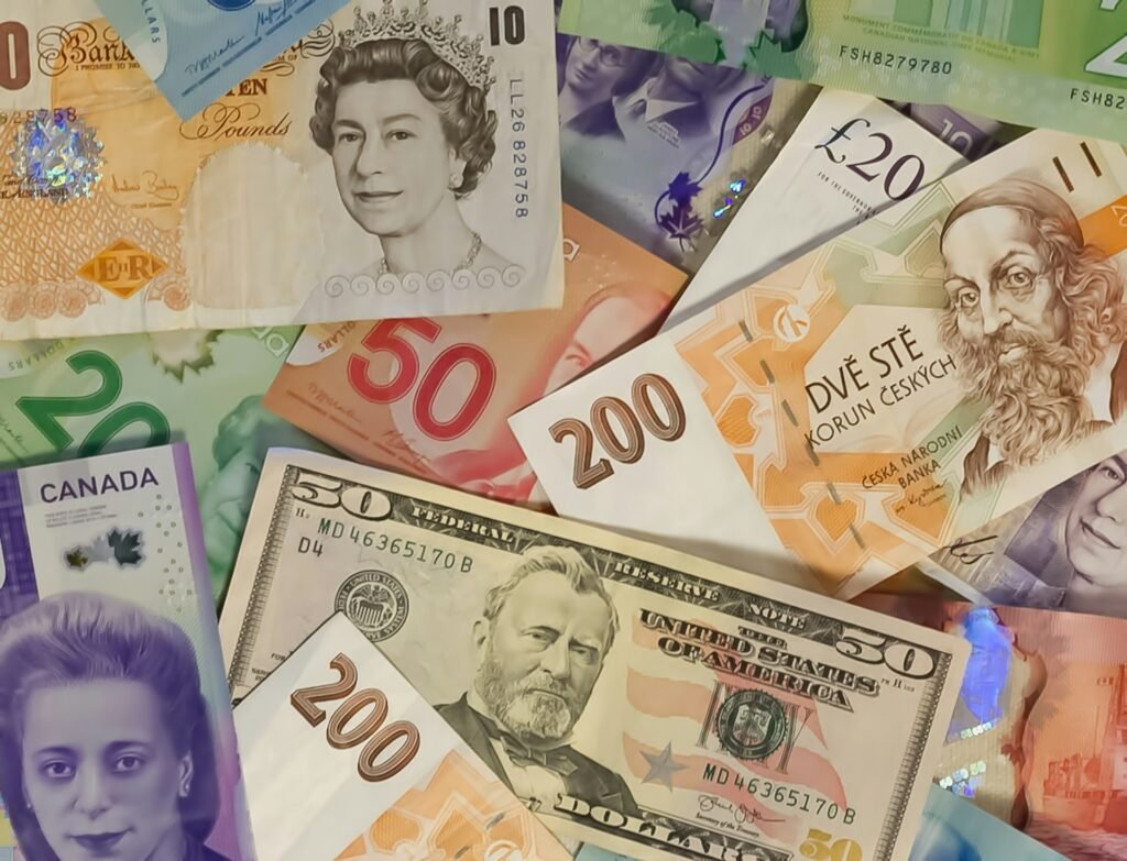 Banknotes from the UK, Canada, the US and other countries spread out together