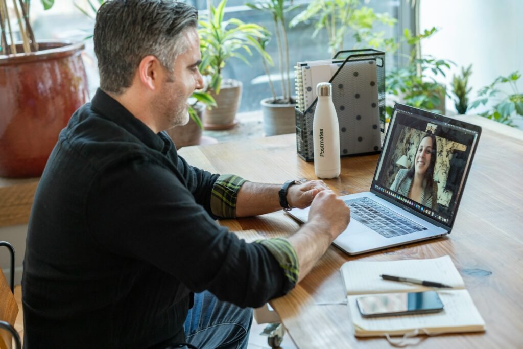 Remote worker on a video job interview from his home office